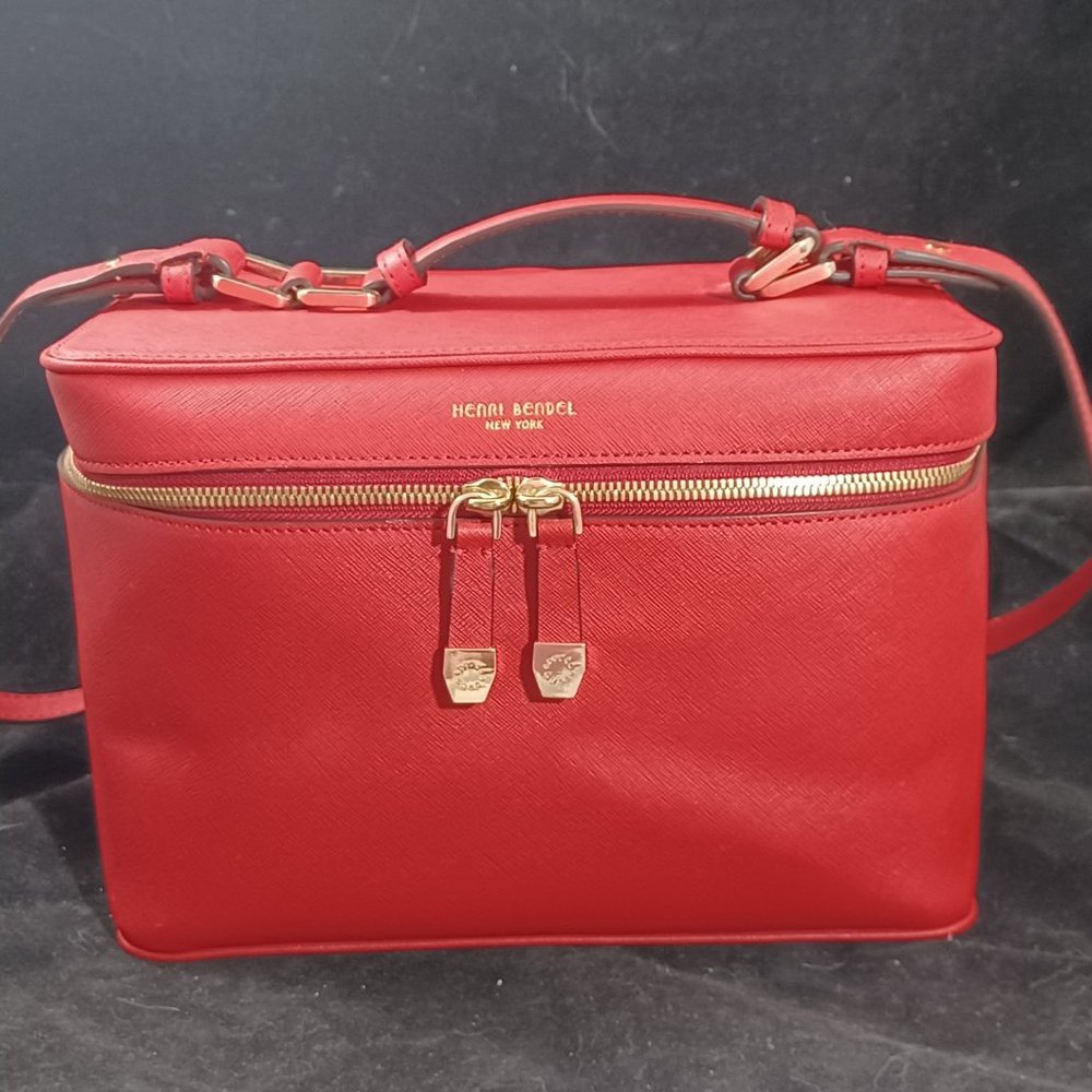 Henri Bendel Saffiano Leather Train Case for cosmetics and travel in iconic red.